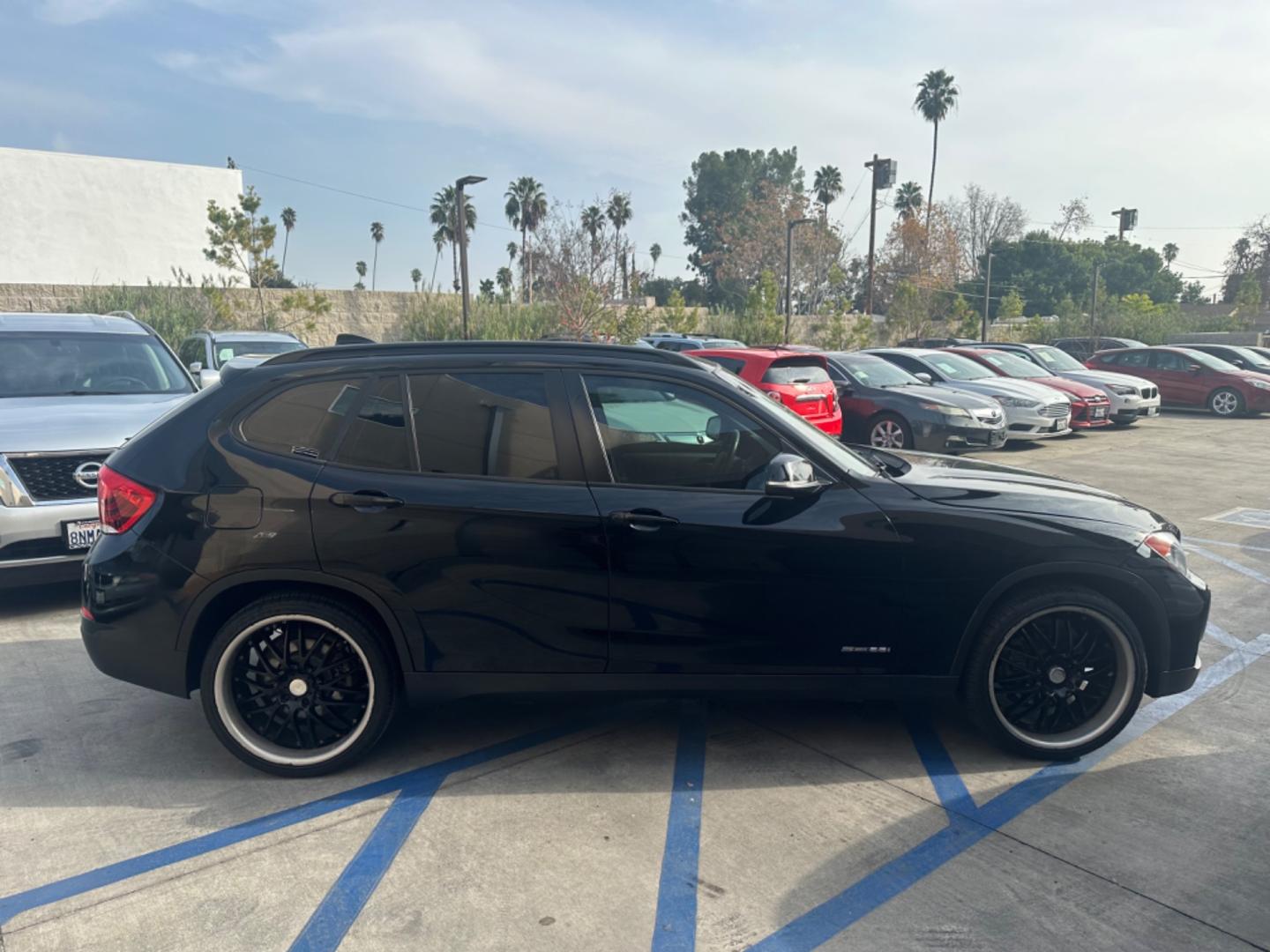 2014 Black /Black BMW X1 (WBAVM1C57EV) with an 4 CYLINDER engine, Automatic transmission, located at 30 S. Berkeley Avenue, Pasadena, CA, 91107, (626) 248-7567, 34.145447, -118.109398 - Photo#6